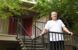 Fresno Bee article man standing on outdoor staircase